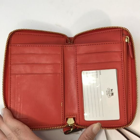 COACH Orange Zip Around Patent Leather Wristlet Wallet